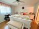 Main bedroom with king bed, wood floors and ceiling fan at 3310 Loveland Blvd # 606, Punta Gorda, FL 33980
