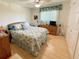 Bedroom with queen-size bed and ample closet space at 3310 Loveland Blvd # 606, Punta Gorda, FL 33980