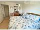 Bright bedroom with a king-size bed and dresser at 3310 Loveland Blvd # 606, Punta Gorda, FL 33980