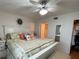 Spacious main bedroom with king-size bed and ceiling fan at 3310 Loveland Blvd # 606, Punta Gorda, FL 33980