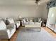 Living room with comfy seating, coffee table, and ceiling fan at 3310 Loveland Blvd # 606, Punta Gorda, FL 33980
