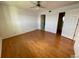 Bright bedroom with wood flooring and ceiling fan at 3310 Loveland Blvd # 606, Punta Gorda, FL 33980