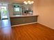 Dining area with light wood floors and a view of the living room at 3310 Loveland Blvd # 606, Punta Gorda, FL 33980