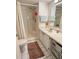 Clean bathroom with shower/tub combo, vanity, and linen closet at 3310 Loveland Blvd # 606, Punta Gorda, FL 33980