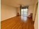 Spacious living room with laminate floors and sliding glass doors at 3310 Loveland Blvd # 606, Punta Gorda, FL 33980