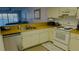 Kitchen with stainless steel appliances and a view to living area at 3600 Bal Harbor Blvd # 2-O, Punta Gorda, FL 33950