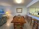 Spacious dining area with a large wooden table and chairs at 3600 Bal Harbor Blvd # 2-O, Punta Gorda, FL 33950