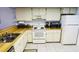 Well-equipped kitchen featuring white cabinets and wood countertops at 3600 Bal Harbor Blvd # 2-O, Punta Gorda, FL 33950
