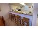 Kitchen with breakfast bar and three bar stools at 3600 Bal Harbor Blvd # 2-O, Punta Gorda, FL 33950