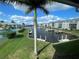 Stunning waterfront view of canal, boats, and lush landscaping at 3600 Bal Harbor Blvd # 2-O, Punta Gorda, FL 33950