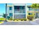 Building exterior showcasing balcony and landscaping at 3600 Bal Harbor Blvd # 2-O, Punta Gorda, FL 33950
