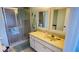 Bathroom features a large vanity with double sinks and a shower at 3600 Bal Harbor Blvd # 2-O, Punta Gorda, FL 33950