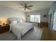 Main bedroom with a king-size bed and water view at 3600 Bal Harbor Blvd # 2-O, Punta Gorda, FL 33950