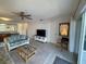 Living room features a sofa, coffee table, and TV at 3600 Bal Harbor Blvd # 2-O, Punta Gorda, FL 33950