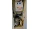 Mechanical room with water heater and AC unit at 3600 Bal Harbor Blvd # 2-O, Punta Gorda, FL 33950