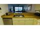 Kitchen with double sink and view into living room at 3600 Bal Harbor Blvd # 2-O, Punta Gorda, FL 33950