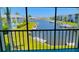 Community pool, tennis courts and canal views from balcony at 3600 Bal Harbor Blvd # 2-O, Punta Gorda, FL 33950