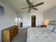 Bright bedroom with a king-size bed and access to a balcony at 3600 Bal Harbor Blvd # 2-O, Punta Gorda, FL 33950