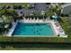 Refreshing community pool with people enjoying the water at 3600 Bal Harbor Blvd # 2-O, Punta Gorda, FL 33950