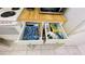 Open drawers revealing organized silverware and utensils at 3600 Bal Harbor Blvd # 2-O, Punta Gorda, FL 33950