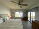 Main bedroom with water views and a ceiling fan at 3600 Bal Harbor Blvd # 2-O, Punta Gorda, FL 33950