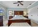 Main bedroom with a king-size bed and an ensuite bathroom at 18189 Ohara Dr, Port Charlotte, FL 33948