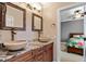 Shared bath with double sinks, granite countertop at 18189 Ohara Dr, Port Charlotte, FL 33948