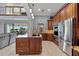 Open kitchen with island and stainless steel appliances at 18189 Ohara Dr, Port Charlotte, FL 33948