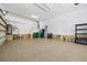 Organized garage featuring epoxy flooring and ample storage solutions at 18189 Ohara Dr, Port Charlotte, FL 33948
