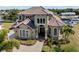 Two-story home on waterfront lot; showcasing the house and its surroundings at 18189 Ohara Dr, Port Charlotte, FL 33948
