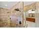 Multi-head shower with marble tile and arch details at 18189 Ohara Dr, Port Charlotte, FL 33948