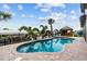 Freeform swimming pool with paver deck and tiki bar at 18189 Ohara Dr, Port Charlotte, FL 33948