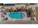 Aerial view of freeform pool, patio, and landscaping at 18189 Ohara Dr, Port Charlotte, FL 33948