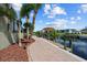 Private dock with covered boat lift and landscaping at 18189 Ohara Dr, Port Charlotte, FL 33948
