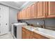 Laundry room with washer, dryer, and granite countertop at 18189 Ohara Dr, Port Charlotte, FL 33948