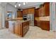 Kitchen with island, stainless steel appliances, and wood cabinets at 18189 Ohara Dr, Port Charlotte, FL 33948