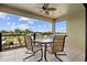 Covered balcony with outdoor seating and scenic water views at 18189 Ohara Dr, Port Charlotte, FL 33948