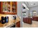 Kitchen features granite counters and wooden cabinets at 18189 Ohara Dr, Port Charlotte, FL 33948