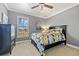 Bedroom with a queen-size bed, dresser, and large window at 18189 Ohara Dr, Port Charlotte, FL 33948