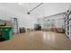 Spacious garage with epoxy flooring, storage shelves, and abundant space at 18189 Ohara Dr, Port Charlotte, FL 33948