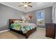 Guest bedroom with queen-size bed and window with shutters at 18189 Ohara Dr, Port Charlotte, FL 33948