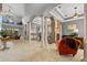 Spacious living area with high ceilings, tiled floors, and a fireplace at 18189 Ohara Dr, Port Charlotte, FL 33948