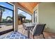 Covered lanai with outdoor dining set and pool access at 18189 Ohara Dr, Port Charlotte, FL 33948