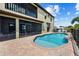 Freeform swimming pool and patio with lounge chairs at 18189 Ohara Dr, Port Charlotte, FL 33948