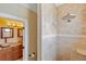 Bathroom with shower, tiled walls, and a vanity with granite countertop at 18189 Ohara Dr, Port Charlotte, FL 33948