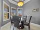 Bright breakfast nook with glass table and four chairs, offering a view at 18189 Ohara Dr, Port Charlotte, FL 33948