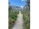 Peaceful nature trail leading to a waterfront gazebo at 13413 Gasparilla Rd # D304, Placida, FL 33946