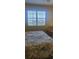 Bright bedroom with water views and plantation shutters at 13413 Gasparilla Rd # D304, Placida, FL 33946
