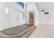 Home entryway with double doors and adjacent laundry area at 2817 Coral Way, Punta Gorda, FL 33950