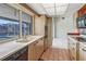 Kitchen features light wood cabinets, tiled floors, and a view of the canal at 2817 Coral Way, Punta Gorda, FL 33950